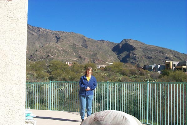 Laura shivering on the deck in back
