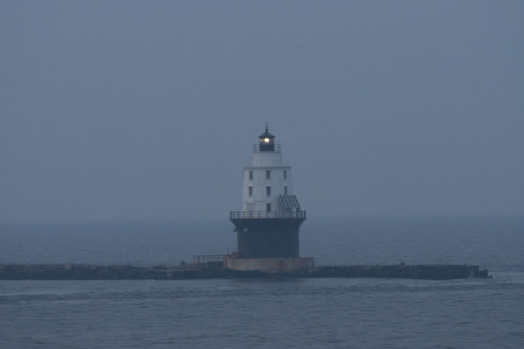 [ Lighthouse at the end of a jetty ]