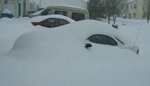 Laura's car buried under snow