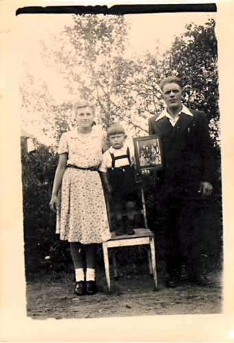 3 people holding a picture
